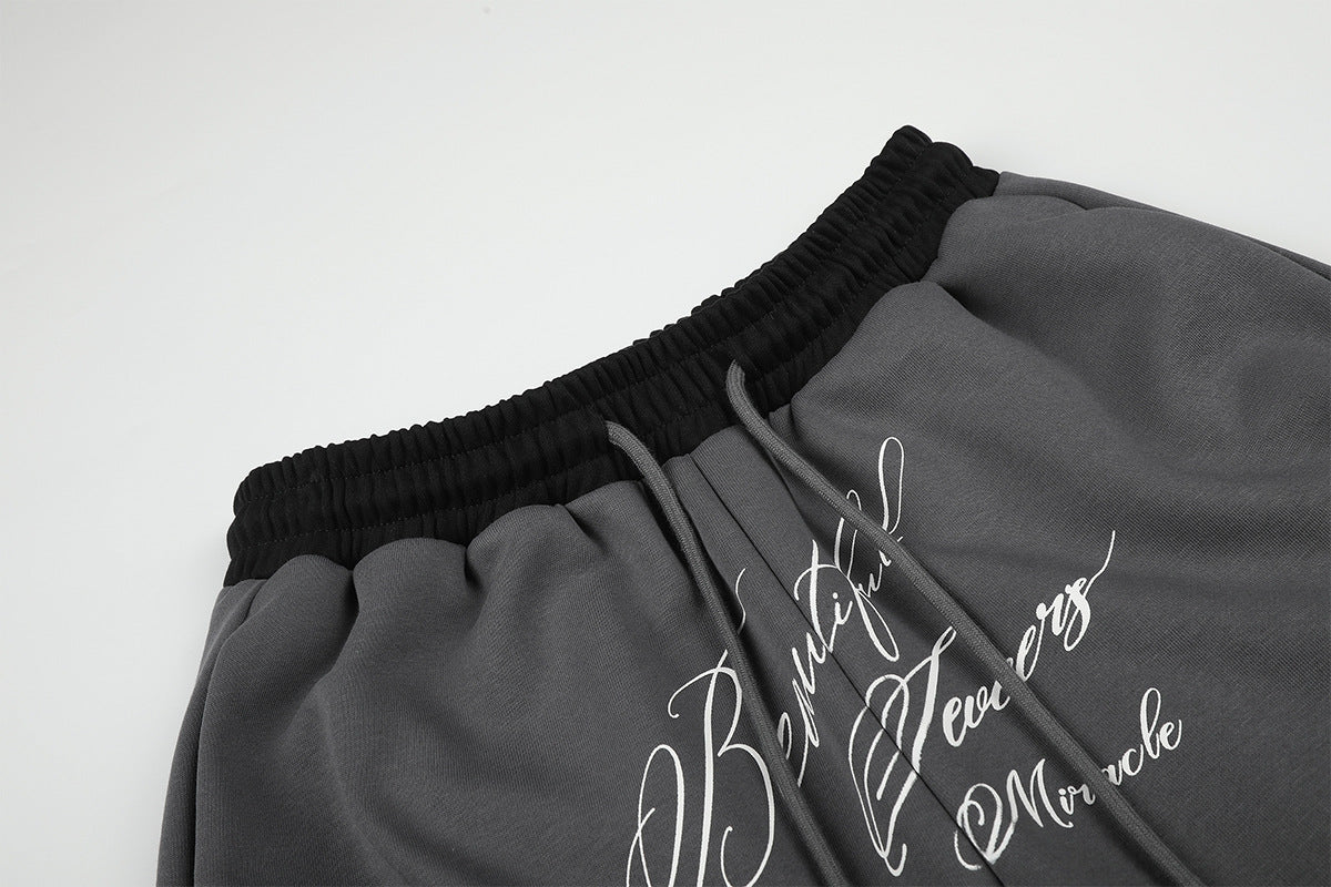 Pantalon de survêtement large à inscription et ceinture contrastante