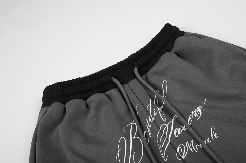 Pantalon de survêtement large à inscription et ceinture contrastante