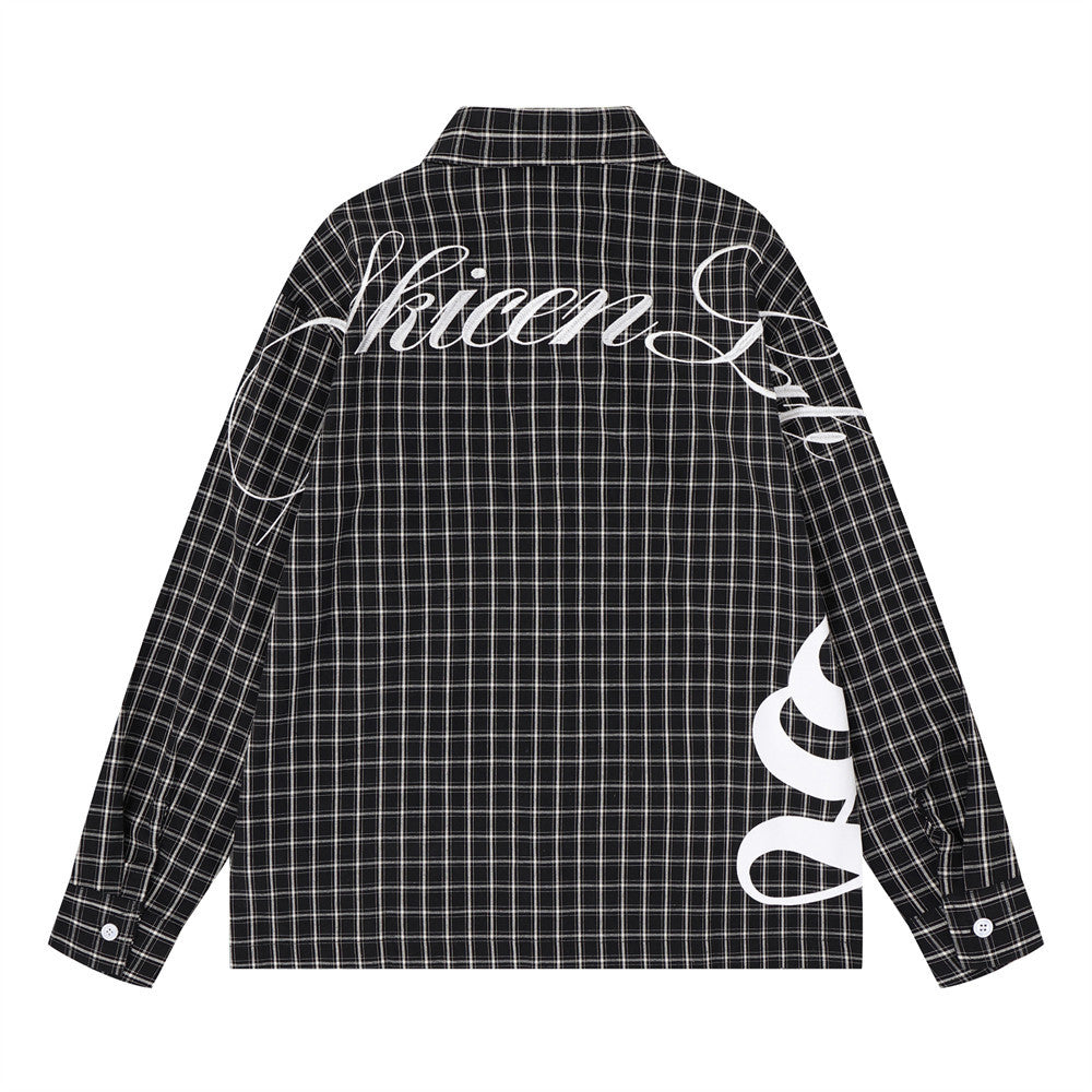 Black plaid long sleeve shirt back view with large white Gothic script across the shoulders