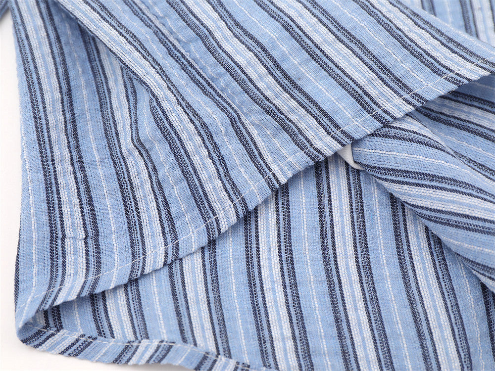 Blue striped sleeve and collar close-up showing layered faux hem detail