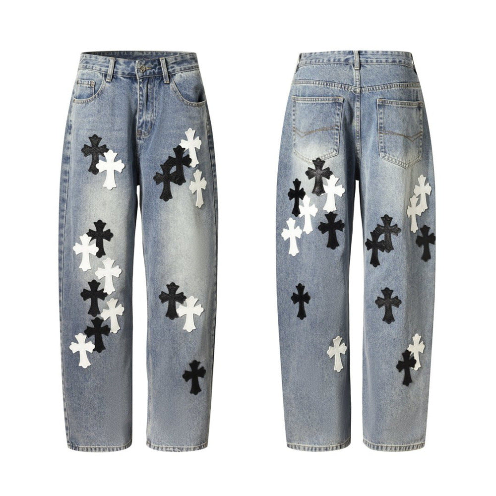 Light wash baggy jeans with black and white cross patches, front and back flat lays
