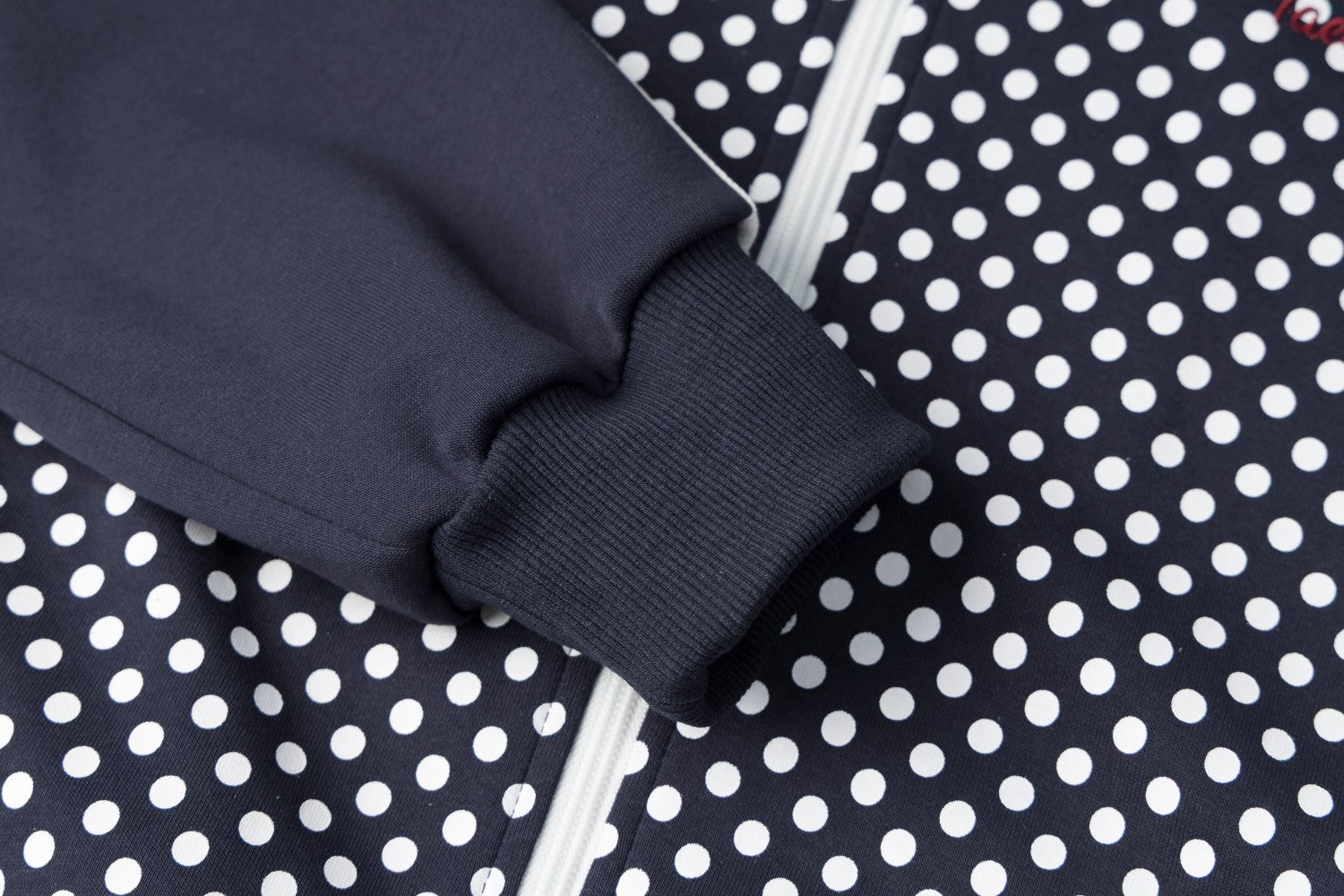 Veste de survêtement zippée à col montant, pois et manches à bandes