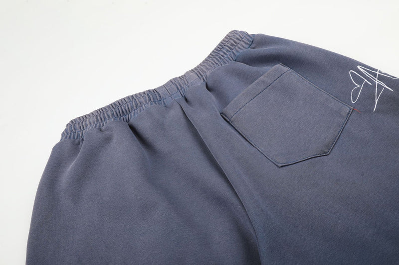 Pantalon de survêtement à jambes larges avec broderies graffiti signature et numéro 26