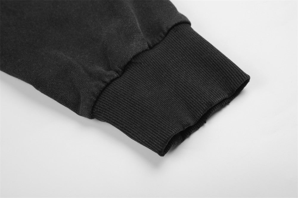 Close-up of ribbed black sleeve cuff on zip-up hoodie
