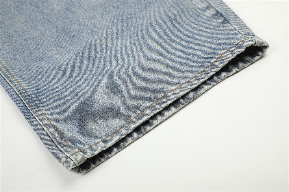 Jean large déchiré pour homme avec ornements en strass et étoiles