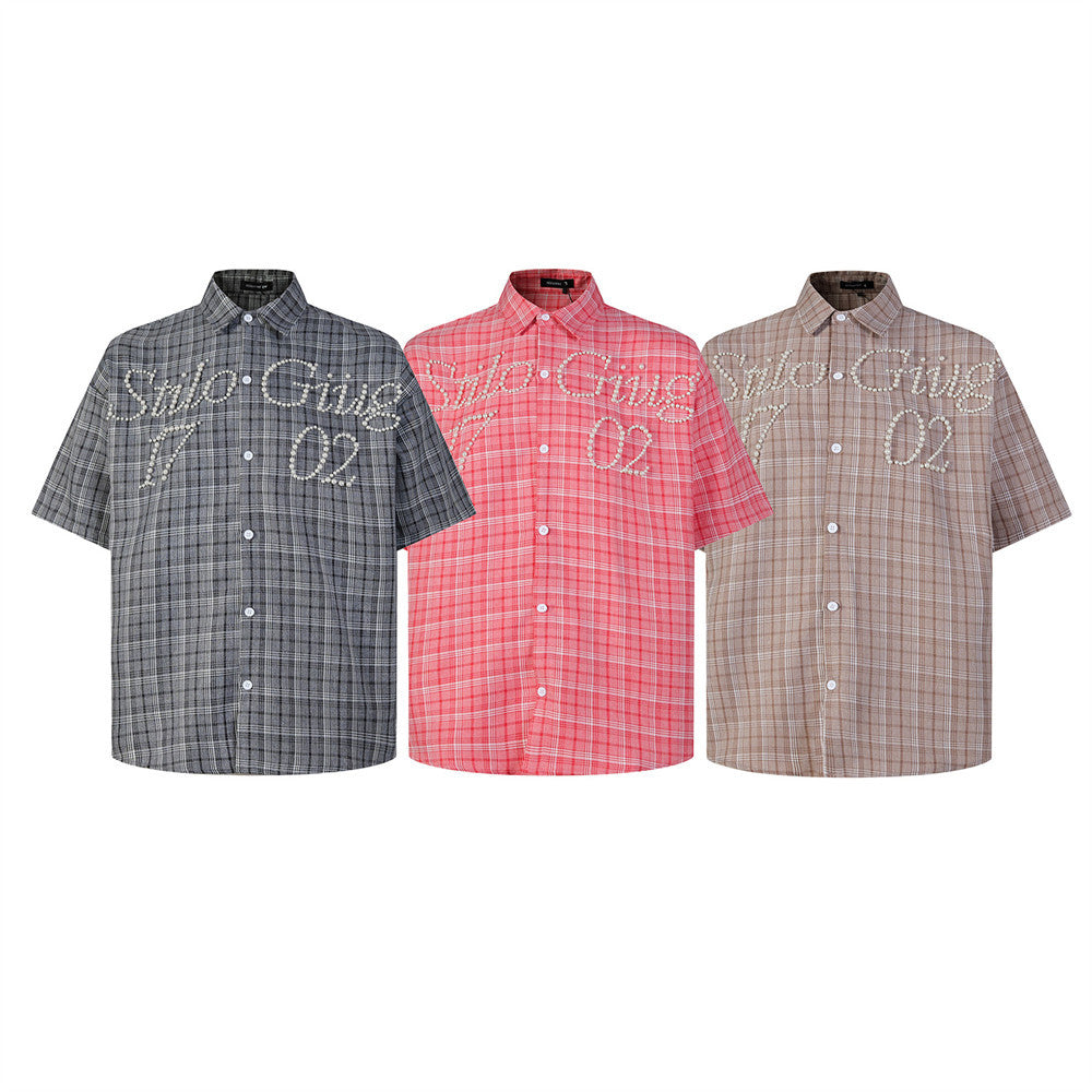 Oversized plaid short sleeve shirt with pearl bead cursive script detail on chest, shown in grey, pink, and khaki colorways