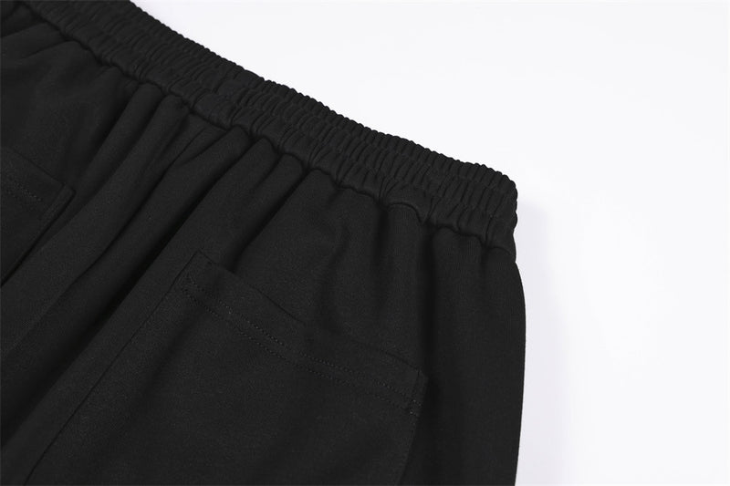 Wide-Leg Sweatpants with Camo & Script Patchwork Appliqués