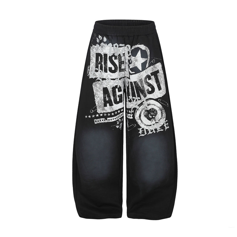 Wide-leg baggy sweatpants with distressed Rise Against graphic print in black colorway, washed streetwear style
