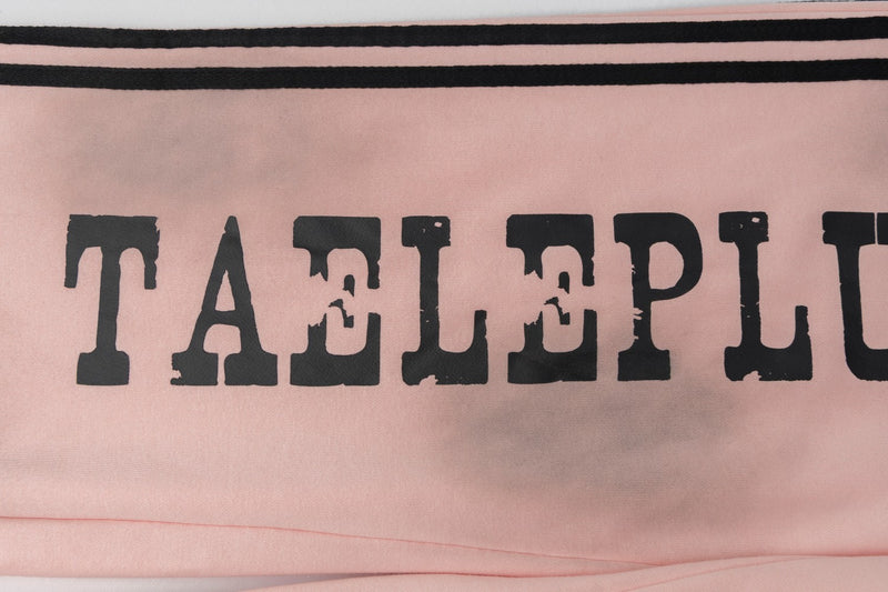 Pantalon de survêtement wide leg – Rose délavé avec bande latérale et écusson brodé