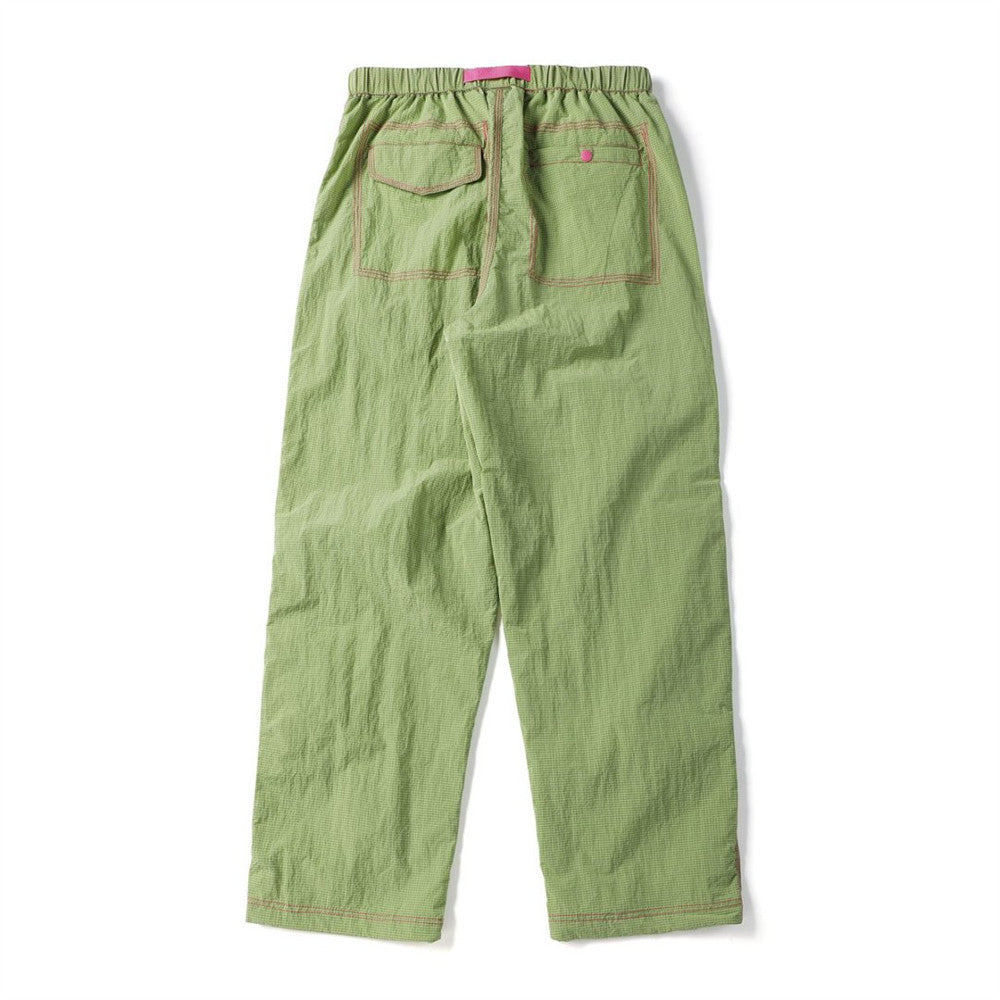 Back view of light green crinkled parachute pants with two outlined rear pockets
