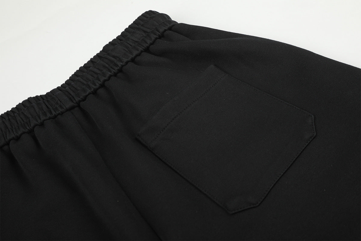Pantalon de survêtement à jambes larges avec délavage dégradé et plis aux genoux