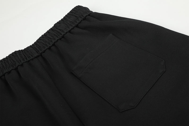 Pantalon de survêtement à jambes larges avec délavage dégradé et plis aux genoux