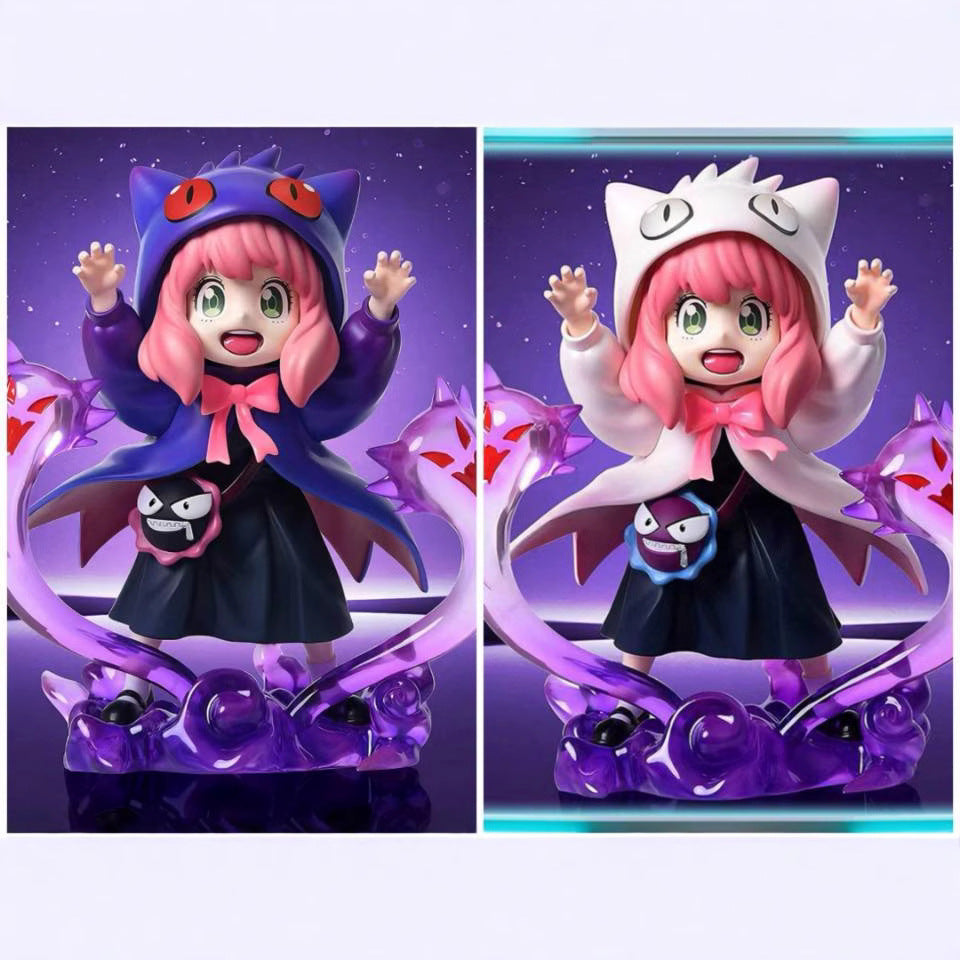 Two side-by-side figures of Anya Forger, from Spy × Family, in vibrant outfits. The left one wears a blue-pink bat motif ensemble, while the right showcases a white-lavender theme. Both 17 cm PVC figures capture her playful essence in Gengar cosplay-inspired poses.