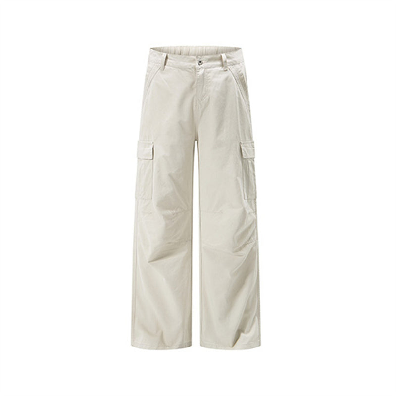 Cream wide-leg cargo pants with side flap pockets, front view