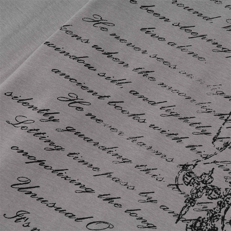 Close-up of gray T-shirt script text print on the front graphic