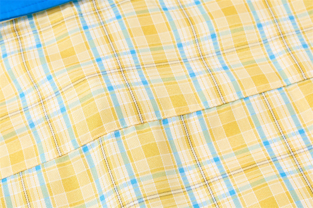 Close-up of back shoulder seam on yellow plaid shirt