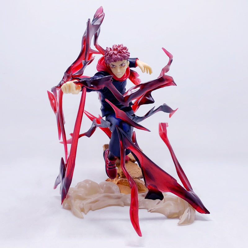 The Jujutsu Kaisen Yuji Itadori PVC Figure (18 cm) features the character with red spiky hair in a dark outfit, posed dramatically with red and black cursed energy tendrils. This collectible statue is positioned on a beige base against a plain white background.