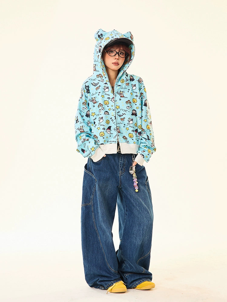 A person wearing a Seakoff Kawaii Cartoon Bear Hoodie with adorable ears and fun cartoon print, oversized blue jeans, and yellow shoes stands against a plain background. The ensemble is completed with glasses for a playful look.