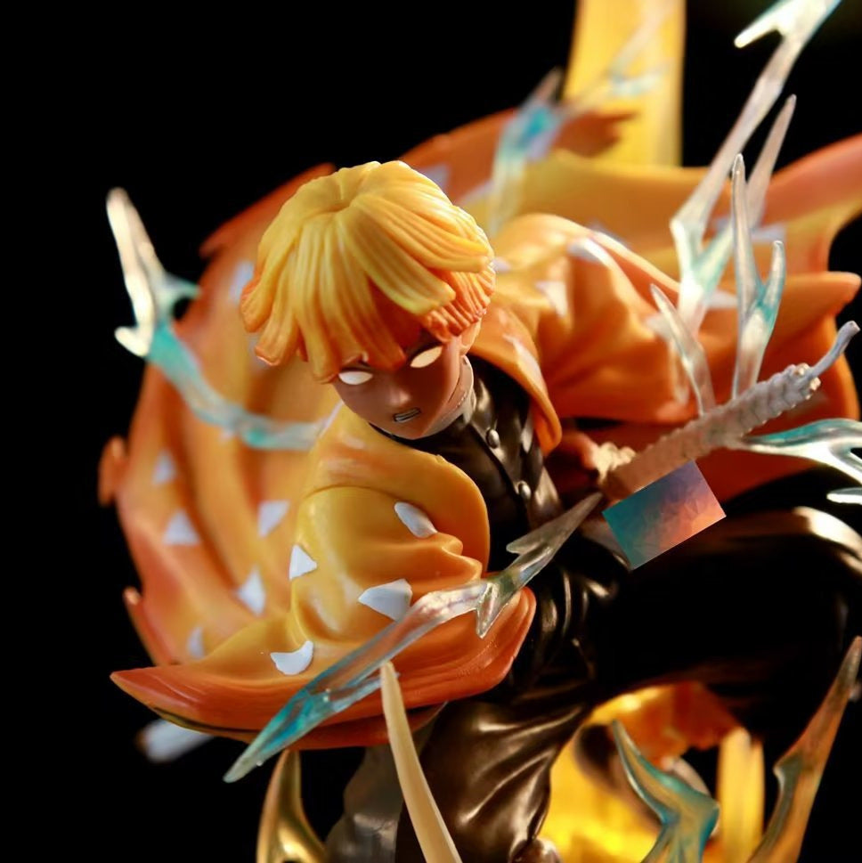 The Rengoku Kyojuro Demon Slayer Flame Hashira Figure features intricate details with a yellow-haired anime character. Clad in an orange cloak with white triangles and wielding a sword amid blue lightning effects, it includes a light-up base and eyes, set against a dark backdrop. High-quality PVC, 350mm tall.