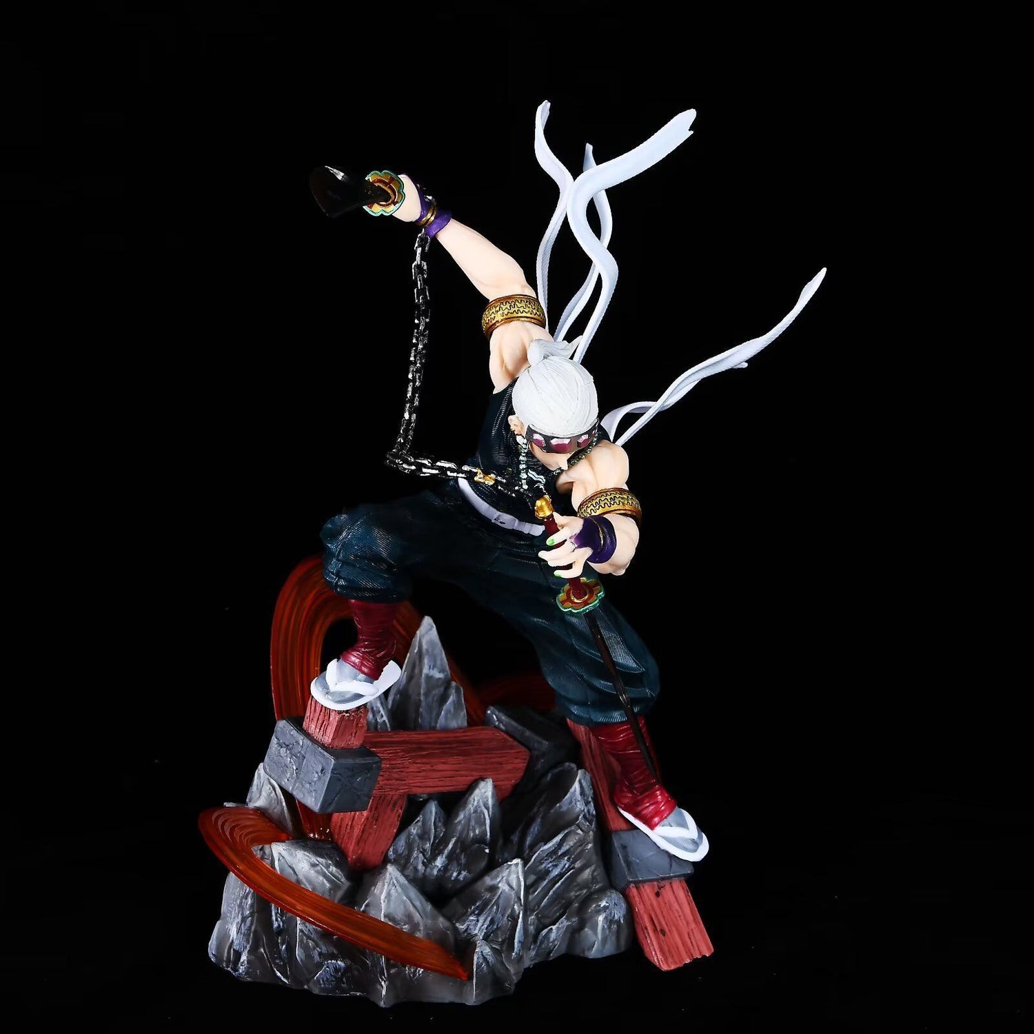 This Tengen Uzui Battle Sound Pillar Figure from Demon Slayer is a 27cm high-quality PVC collectible, featuring intricate details including long white hair in an action pose on a rocky base, dark attire with accessories and weapons, and comes with a double-headed eagle replacement.