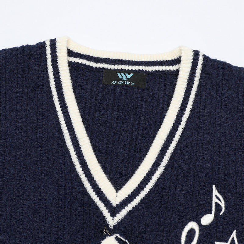 V-Neck Cable Knit Sweater Vest with Music Note Embroidery & Striped Tie Detail