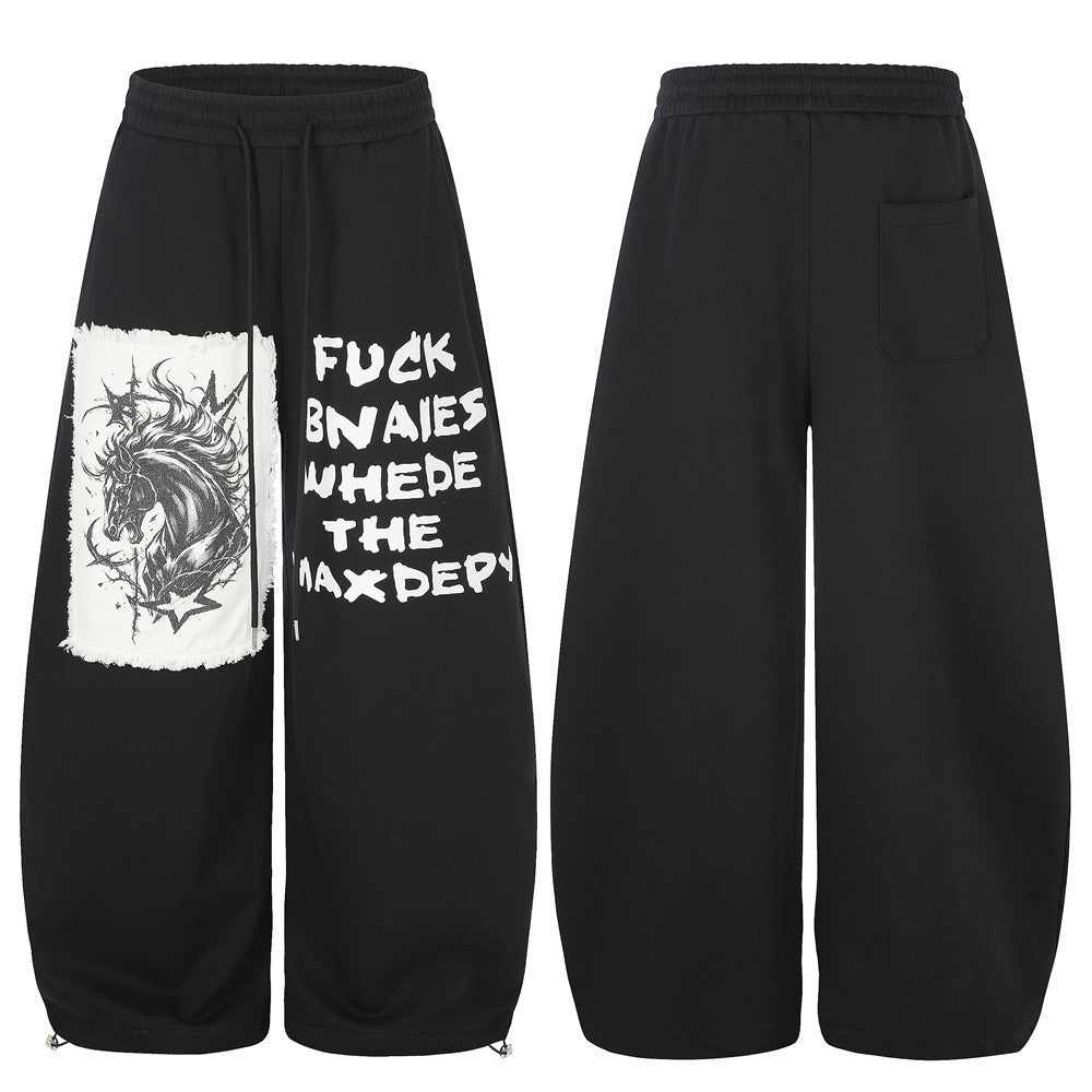 Pantalon de survêtement homme à jambes larges, motif graphique – Écusson licorne et slogan imprimé noir