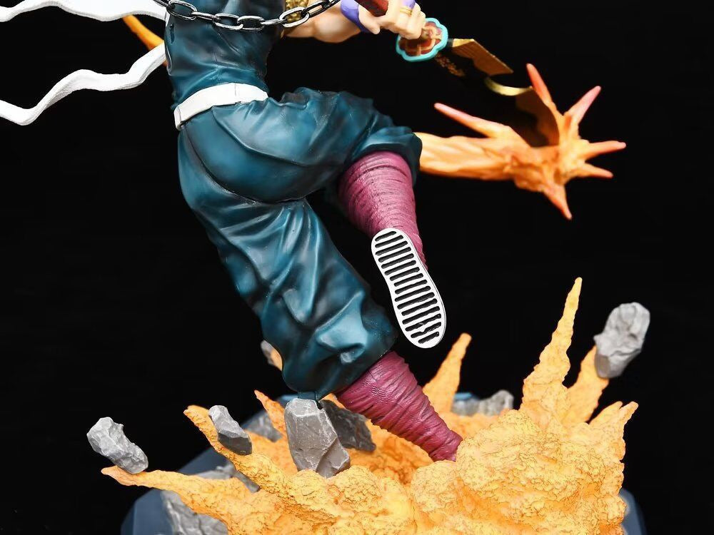 The Seakoff Premium Demon Slayer Urogi Figure, a 37cm high-quality GK model, features a sword with swirling orange flames and gray rocks. Decked in green pants, purple wraps, and chains, its USB light-up effects electrify the black background for a stunning display.