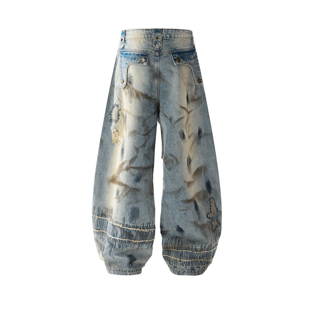 Baggy Wide-Leg Jeans – Chaotic Embroidery, Distressed Denim & Arc-Hem Design