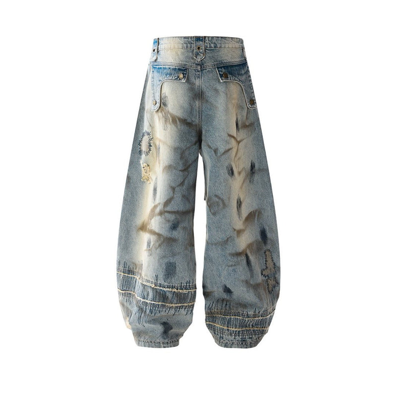 Baggy Wide-Leg Jeans – Chaotic Embroidery, Distressed Denim & Arc-Hem Design
