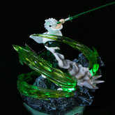 The Premium Demon Slayer Kaze Hashira Sanemi Shinazugawa figure by Demon Slayer is a 30cm GK model featuring USB light-up effects. Sanemi wields a green sword, surrounded by swirling energy on rocky terrain, wearing white and black attire against a black background that enhances his demon-slaying prowess.