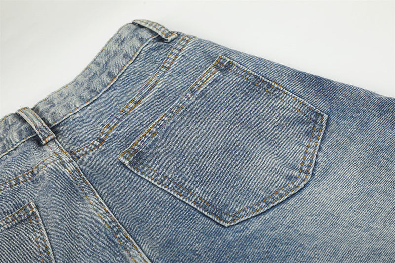 Jean large déchiré pour homme avec ornements en strass et étoiles