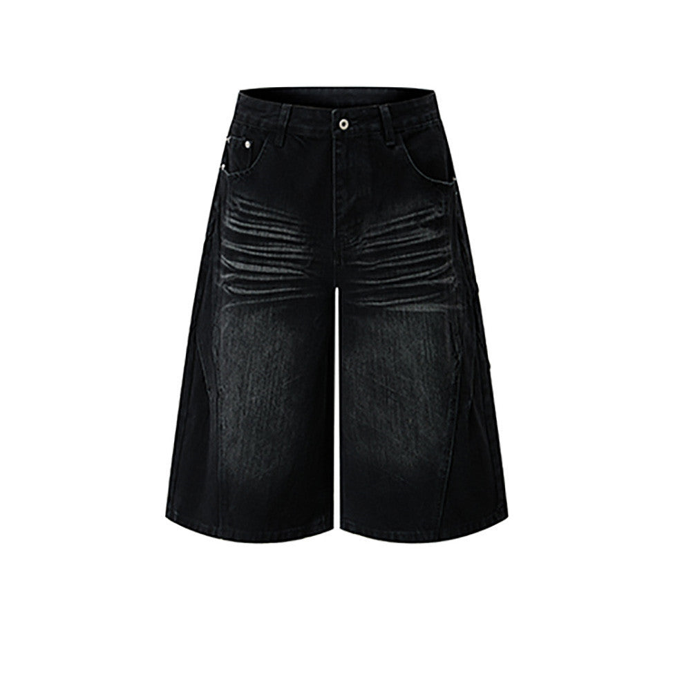 Men's baggy wide-leg distressed denim jean shorts in washed black with vintage crease detailing, front view