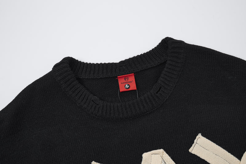 Pull col rond oversize en maille usée avec motif de lettres appliquées