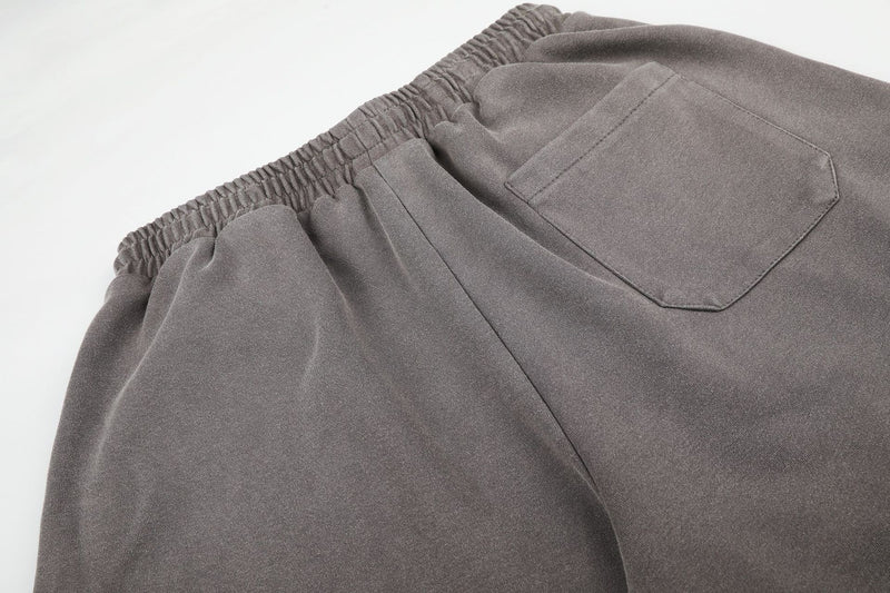 Pantalones de chándal de pierna ancha con cruz estampada y acabado lavado ácido