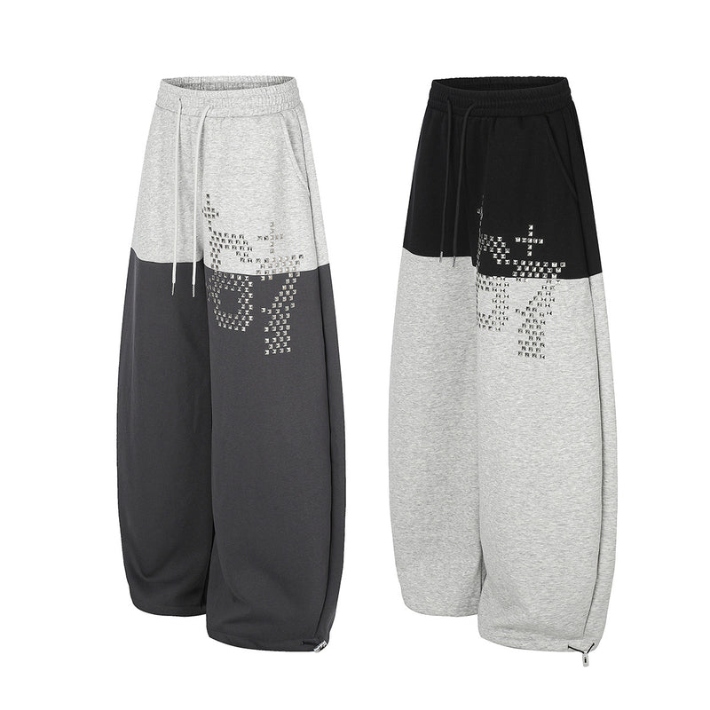 Gerade geschnittene Sweatpants – Colorblock-Baggy-Jogger mit Nieten-Grafik
