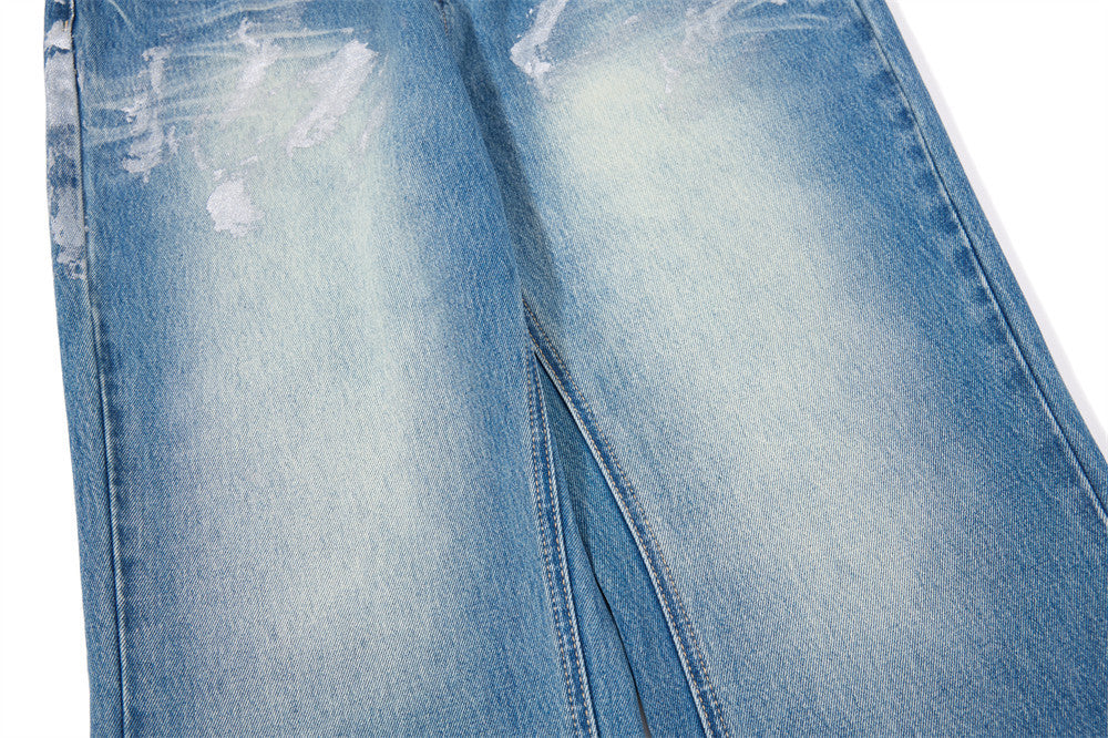 Distressed Flare Jeans – Men's Washed Blue Wide-Leg Denim with Paint Splatter