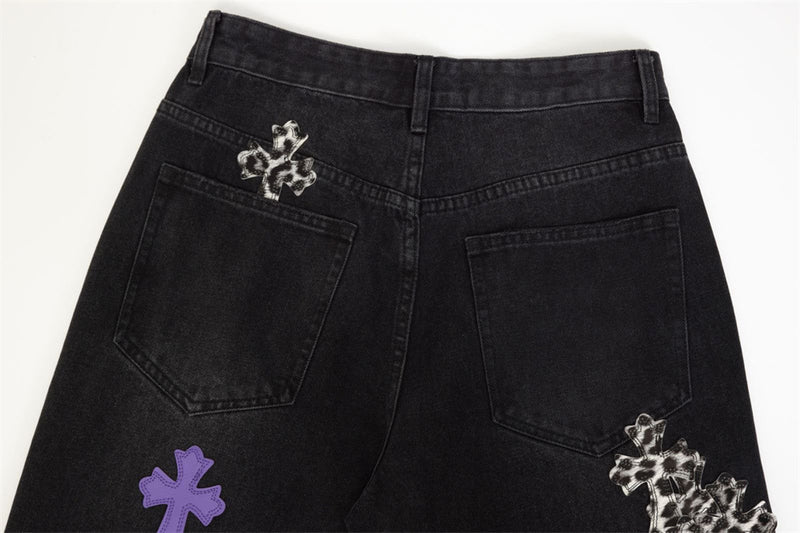 Back of black jeans with patch details near pockets