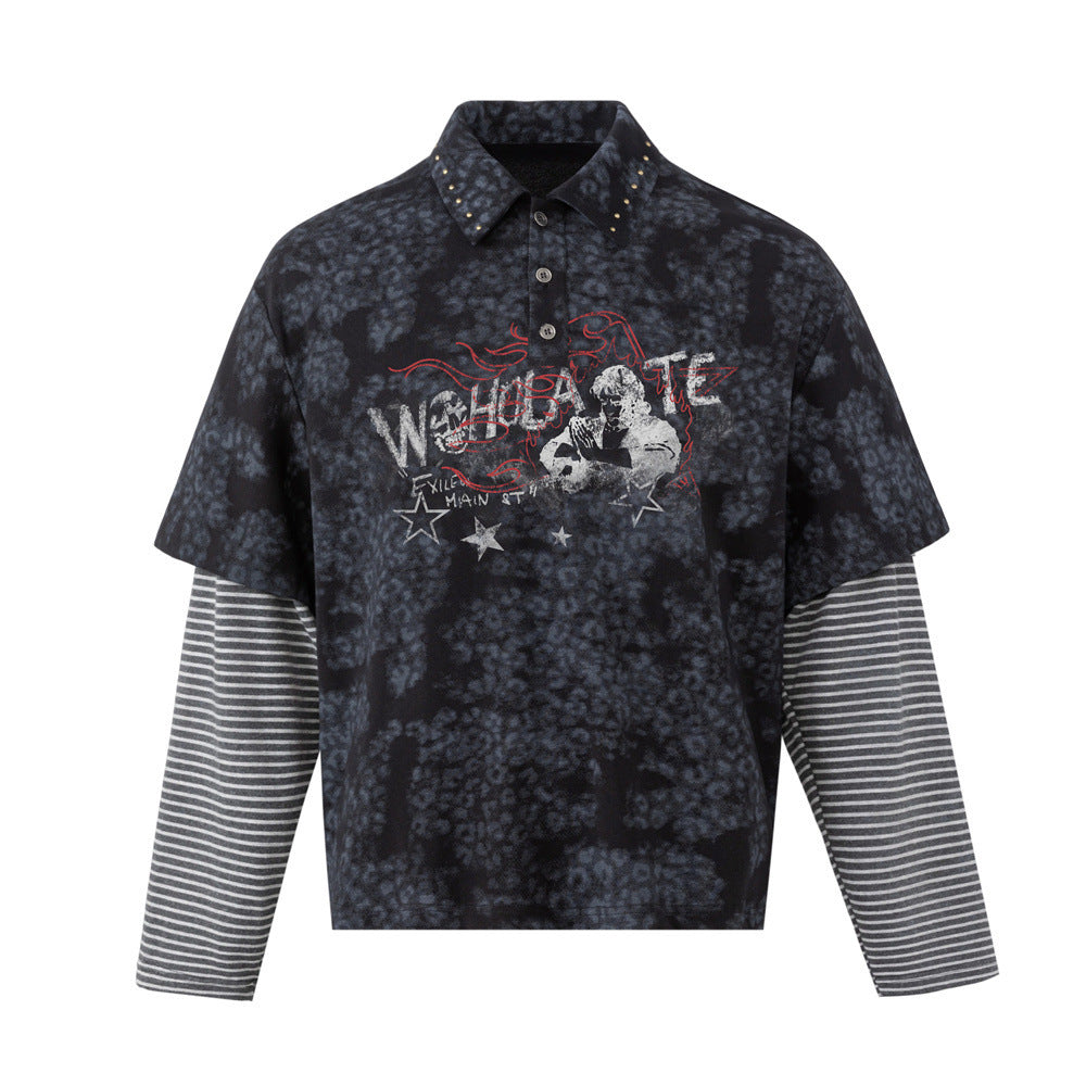 Flat front view of a dark mottled faux-layered polo shirt with striped sleeves, studded collar, and graphic chest print