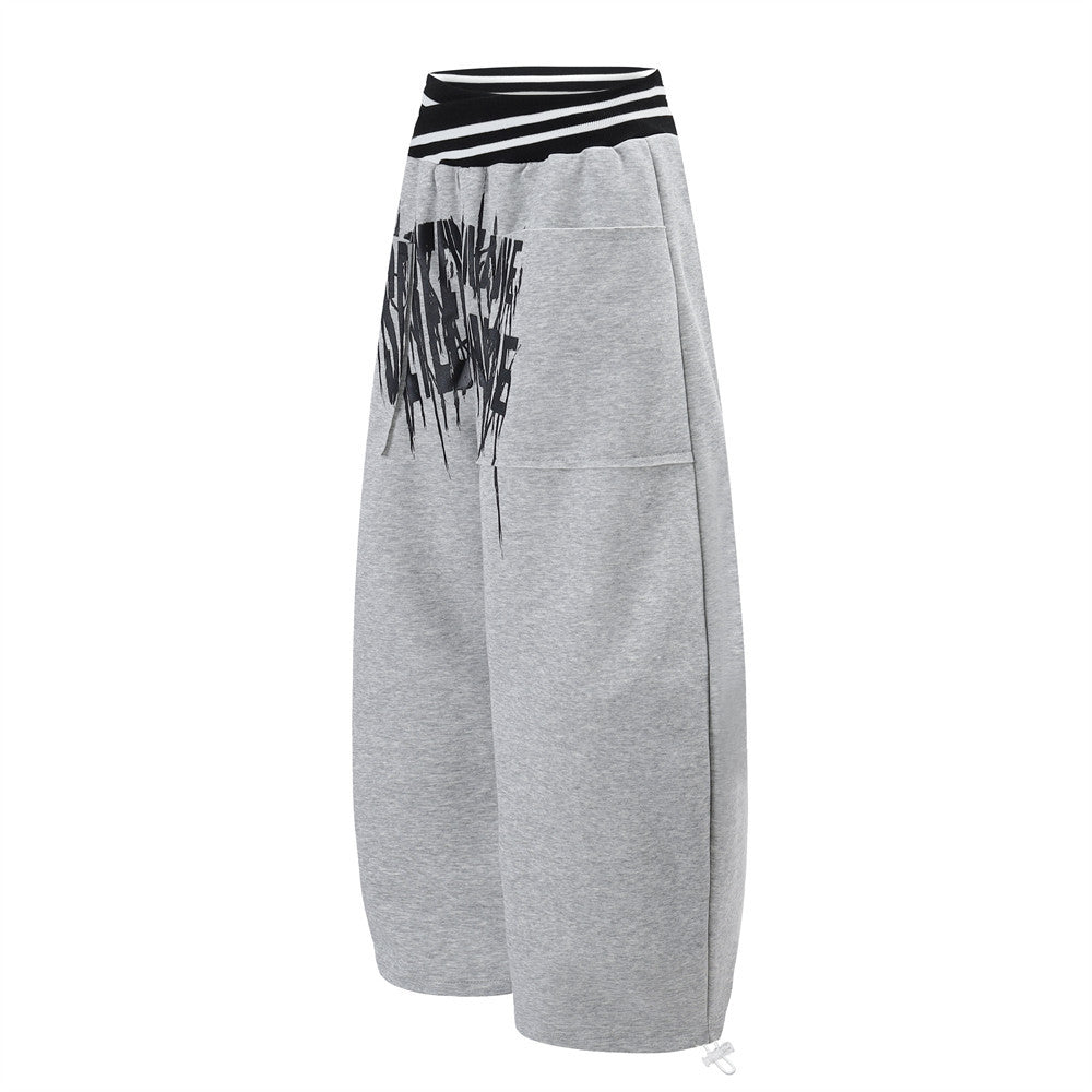 Pantalon de survêtement large à lettrage graffiti avec ceinture croisée contrastante à rayures