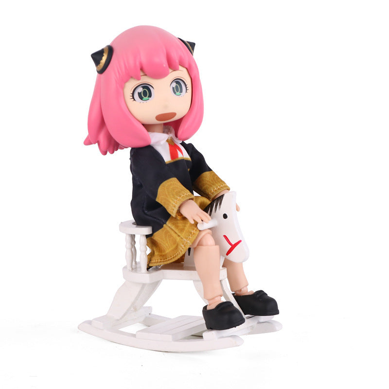 The Anya &amp; Yor Forger Nendoroid Set features a 13CM poseable anime collectible from Spy × Family, showcasing a figure with pink hair, large eyes, and a school uniform. It includes a black jacket, brown skirt, red tie, black shoes, and comes seated on a white rocking horse.