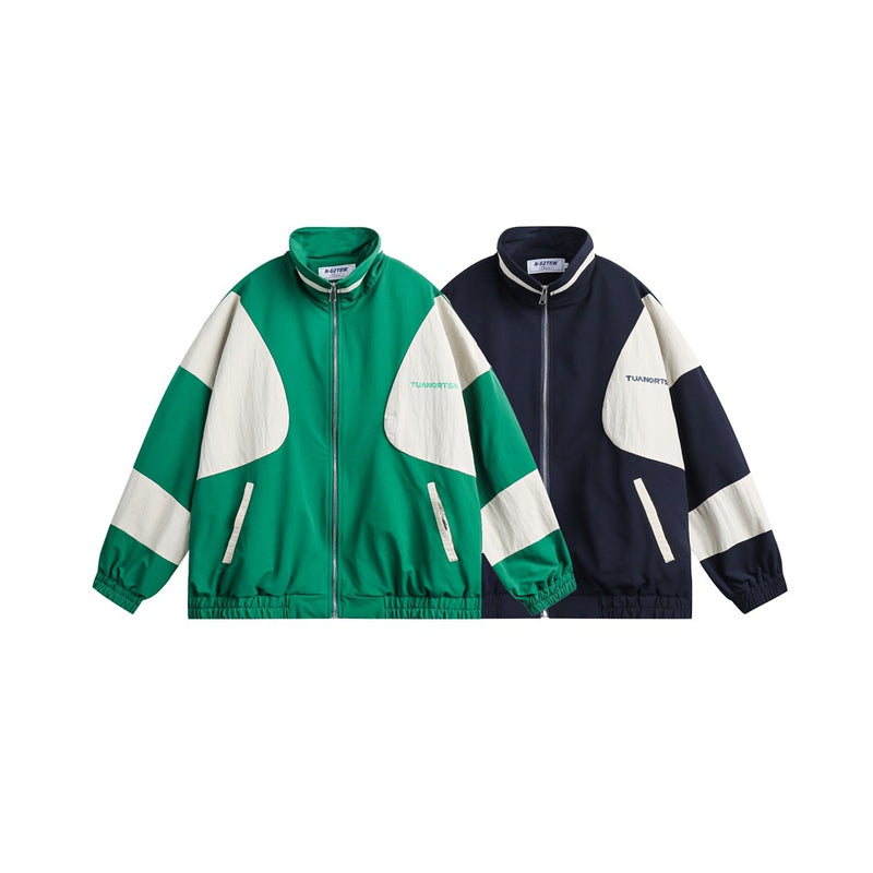 Oversized colorblock zip-up track jacket in navy and green with cream paneling and back logo print