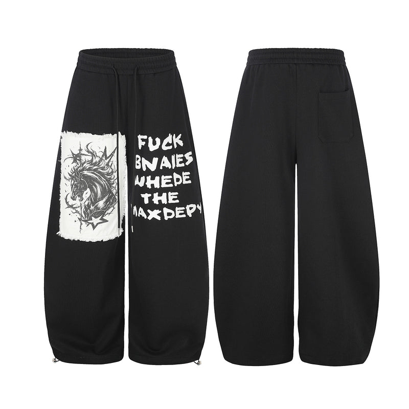 Pantalon de survêtement à jambes larges avec écusson licorne et imprimé graffiti – Streetwear noir