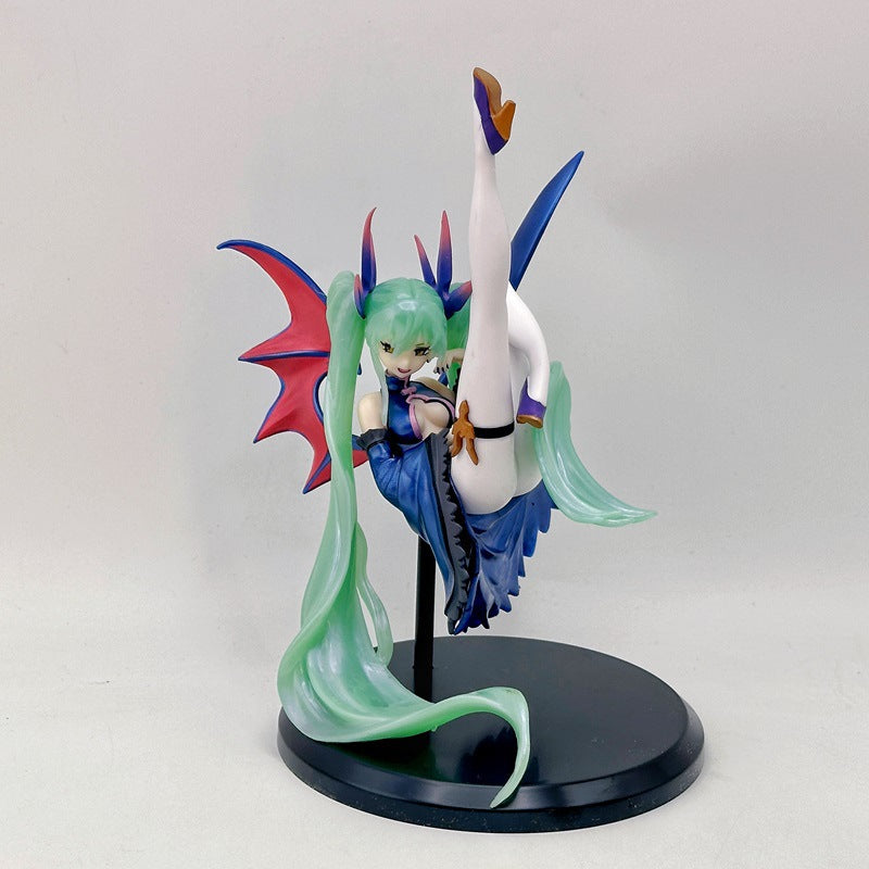 The Hatsune Miku Light &amp; Dark 17cm PVC Figure features a green-haired anime character with bat wings and a blue outfit, striking a dynamic pose with one leg raised. Resembling an angel-demon fusion, she has long twin tails and sits gracefully on a black circular stand.