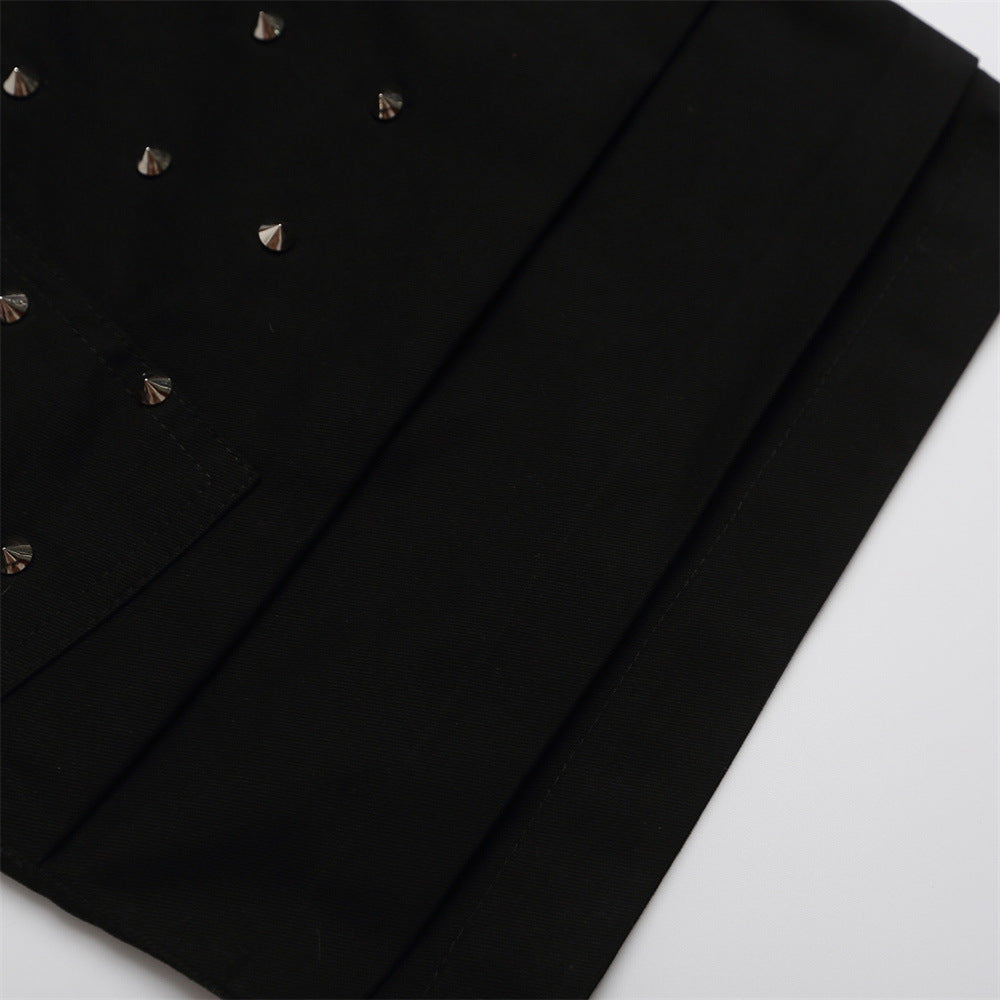 Close-up of black shorts hem with layered cuff detail