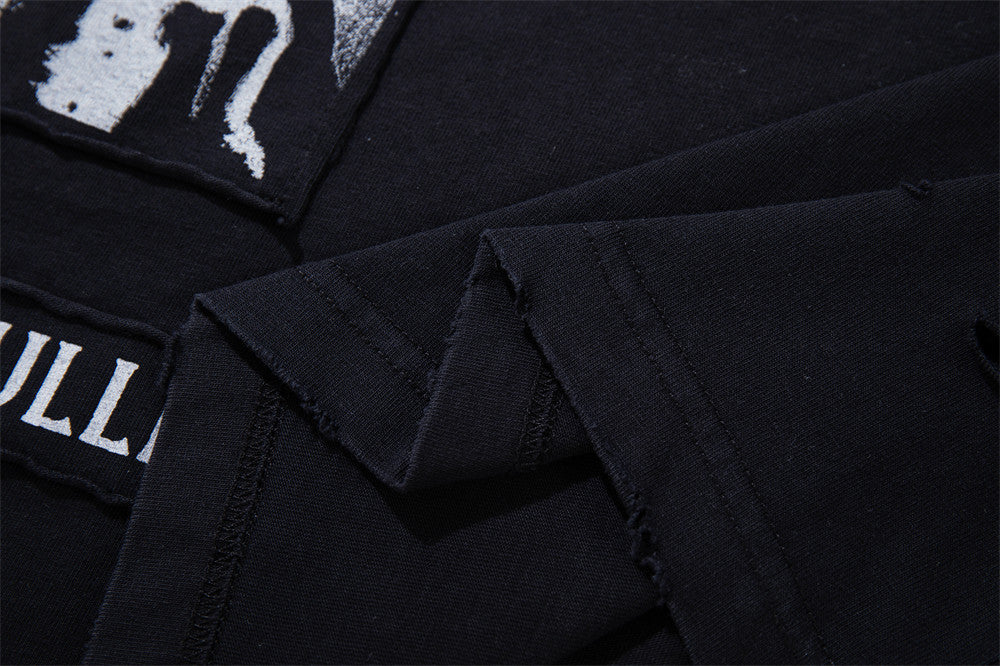 Longsleeve mit dunklen Grafik-Patches – Verwaschenes Oversized-Shirt aus Baumwolle