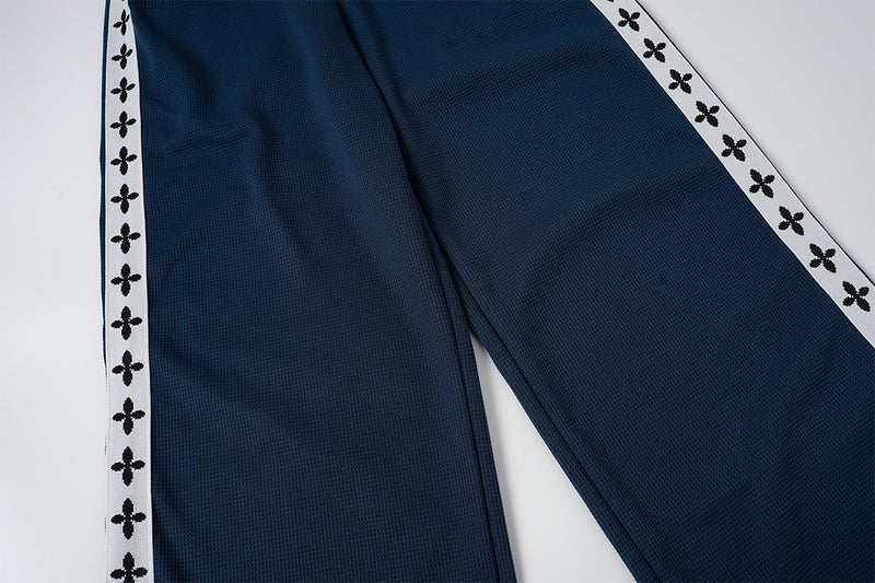 Pantalon de survêtement large à bandes latérales – Pantalon baggy en maille gaufrée