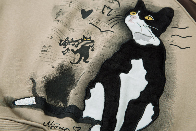 Sweat-shirt motif chat en smoking avec imprimé note de musique et manches raglan color block