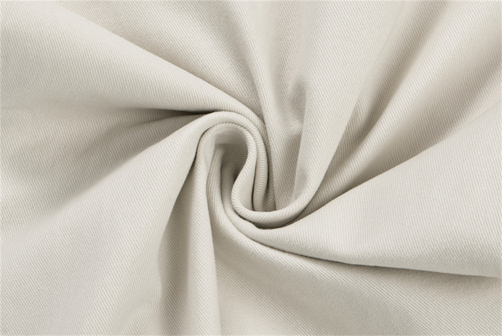 Close-up of cream twill fabric texture