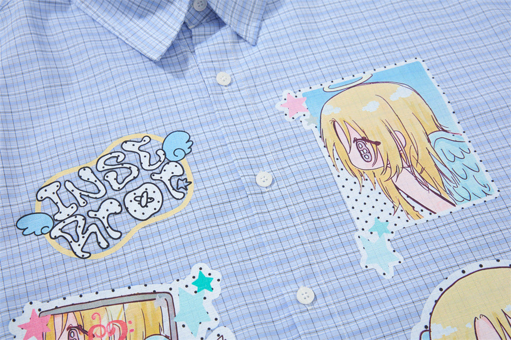 Blue plaid shirt front close-up showing anime graphic and button placket