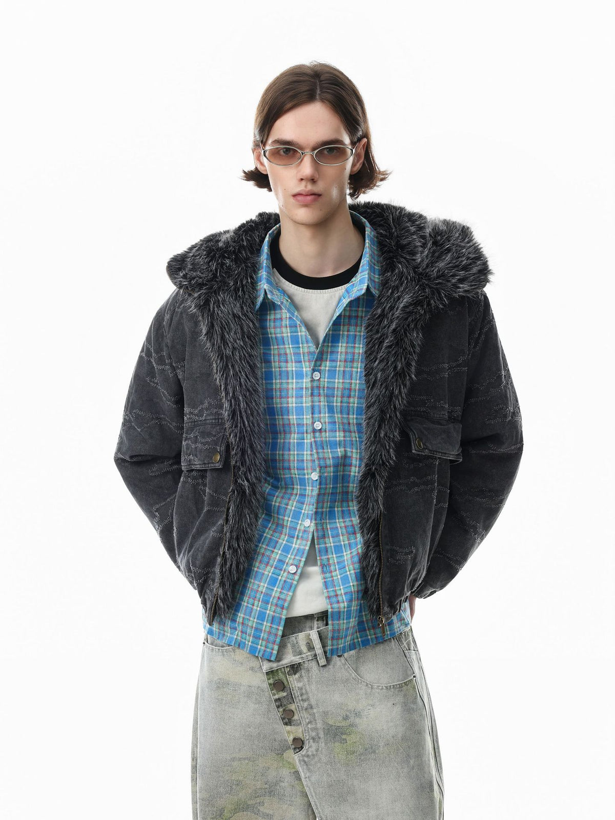 Oversized camo jacquard padded bomber jacket with faux fur hood in washed charcoal grey, worn open over a plaid shirt and wid